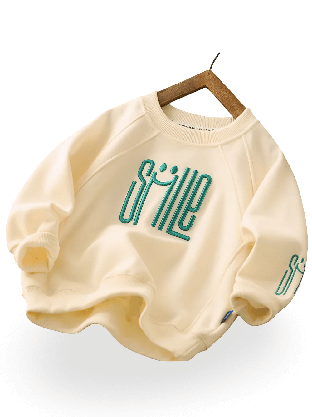 Trendy kids beige sweatshirt with "SMILE" graphic, featuring soft fabric and relaxed fit, perfect for stylish everyday wear.